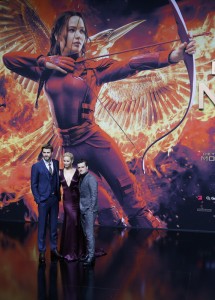 Cast members Hemsworth, Lawrence and Hutcherson pose as they arrive for the world premiere of "The Hunger Games: Mockingjay - Part 2" in Berlin